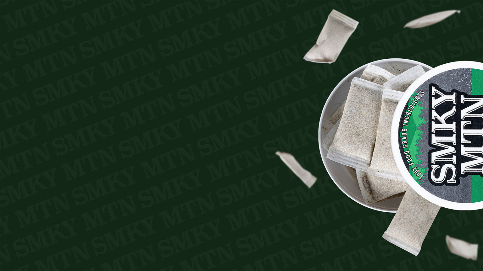 smokey mountain caffeinated pouches falling  with 'SMOKEY MOUNTAIN' branding on a dark green background.